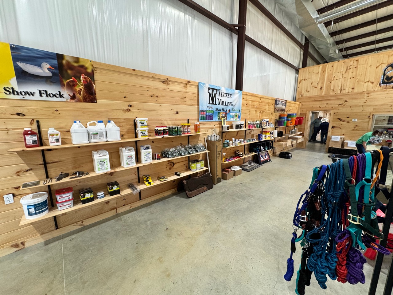 Farm supplies displayed along the wood-paneled store interior